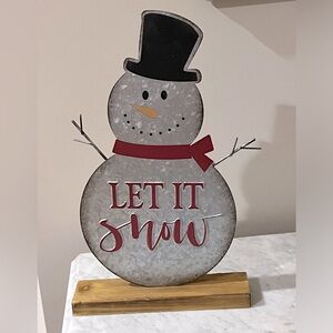 Tin snowman Christmas decoration.